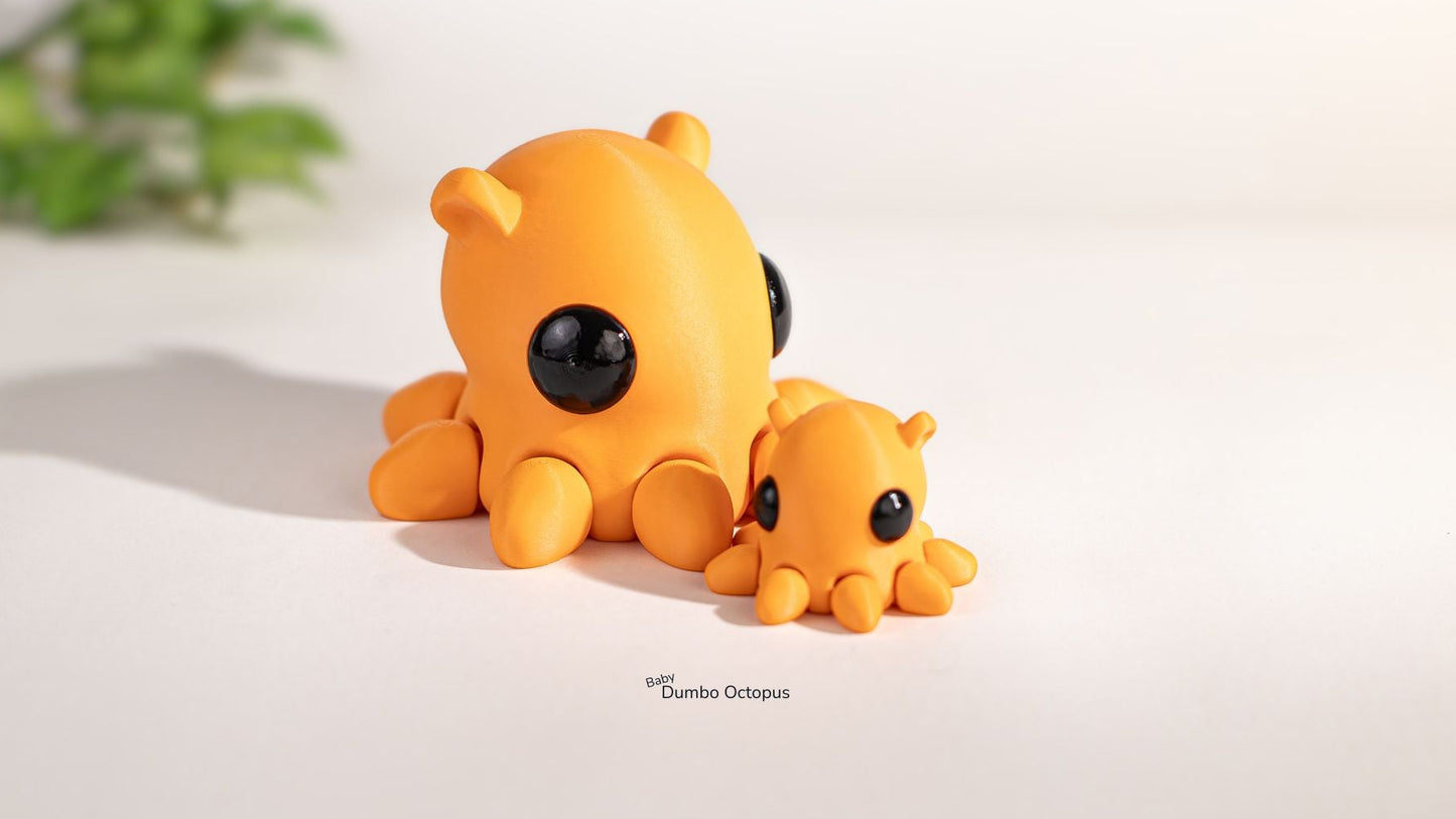 Two small orange octopus figurines on a light background