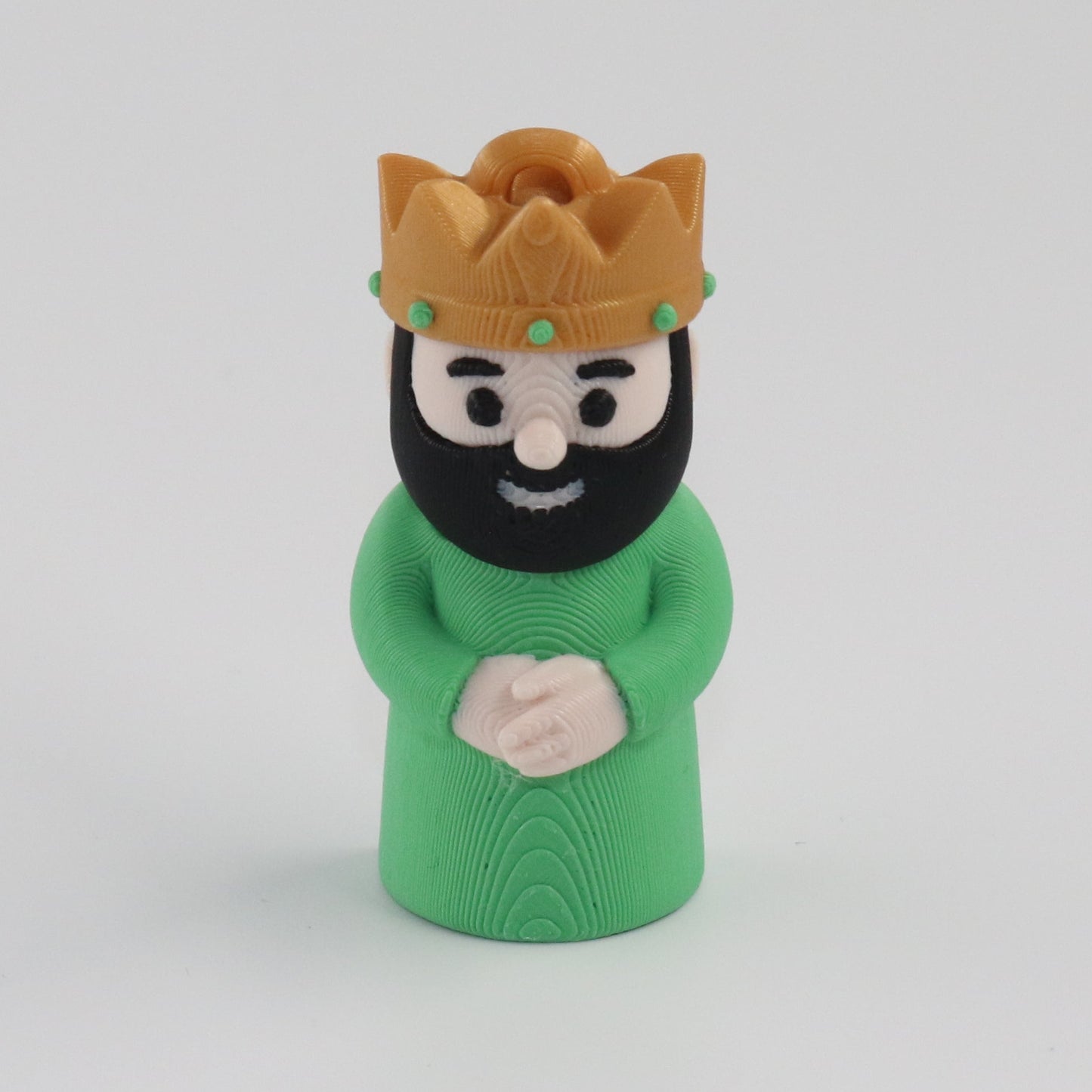 Green figure with a gold crown on a white background