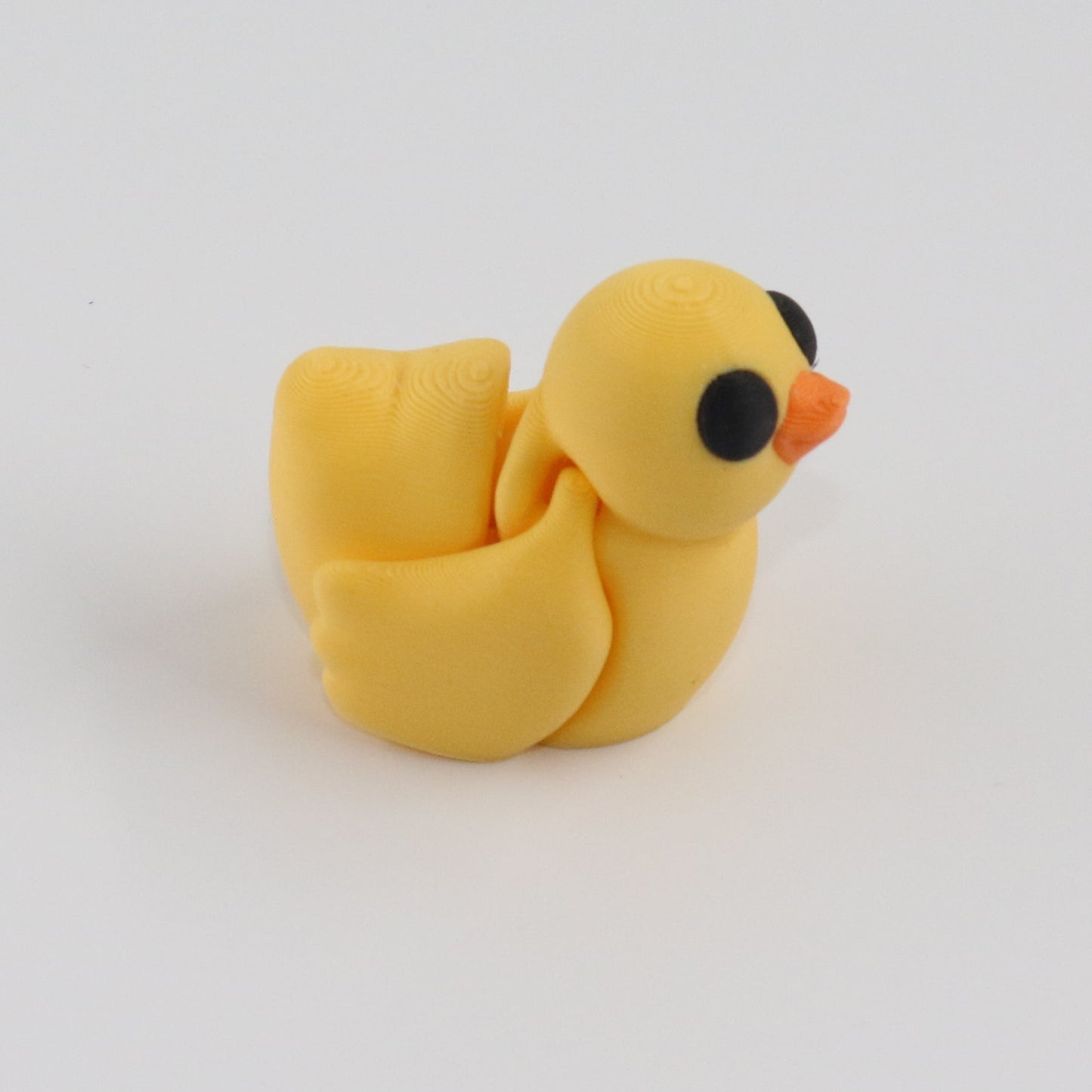 Articulated Yellow Duck on a white background