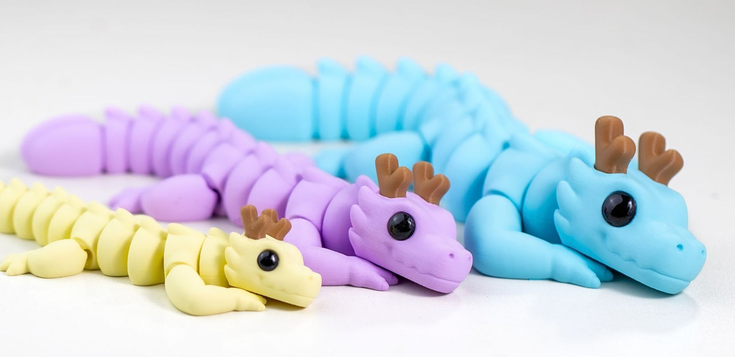 Three colorful mini dragons on a white background with 'Mini Dragon' text.