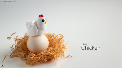 Small chicken figurine on a nest of straw with a white background