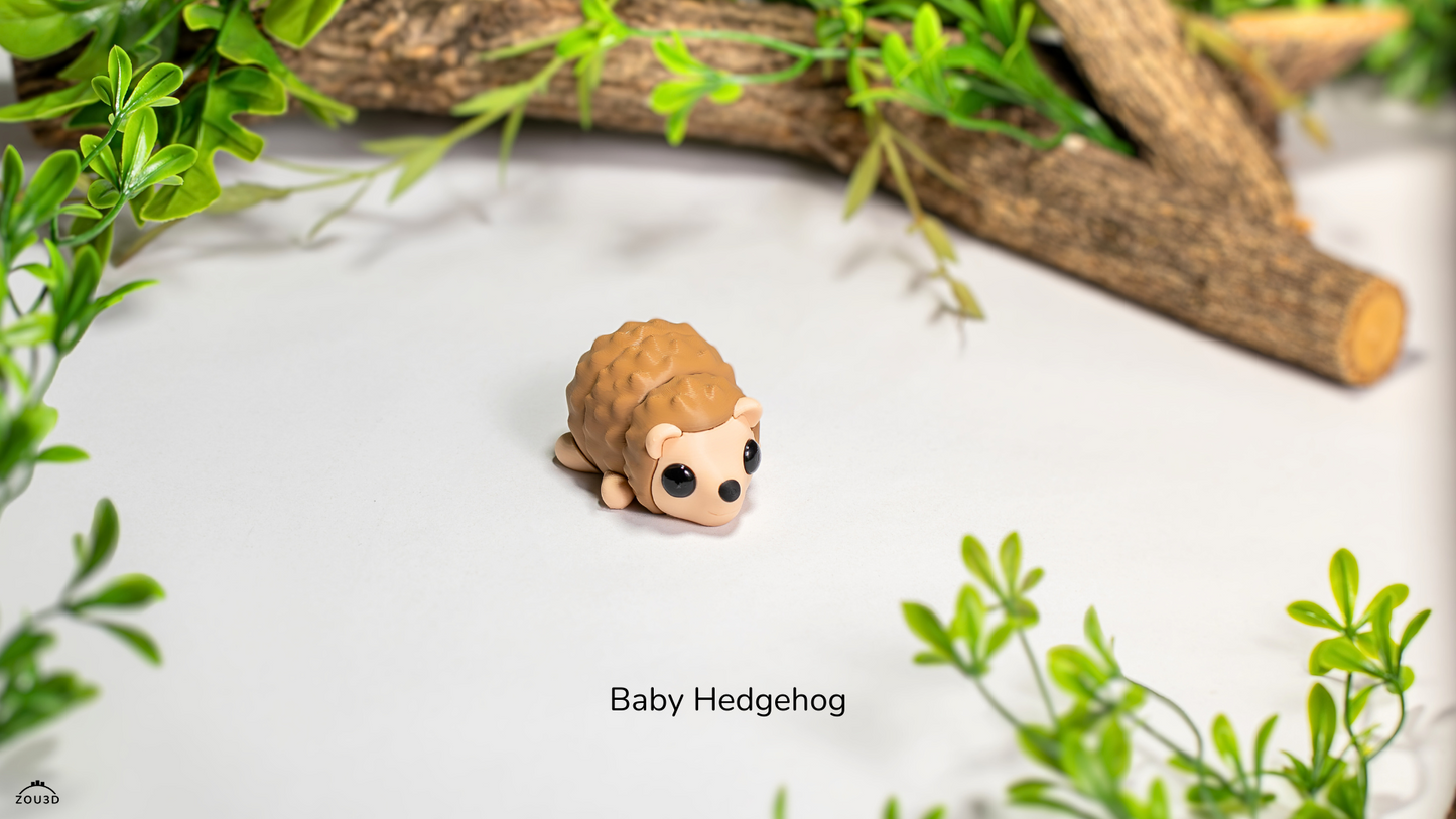 Small hedgehog figurine on a white surface with green plants and wood in the background
