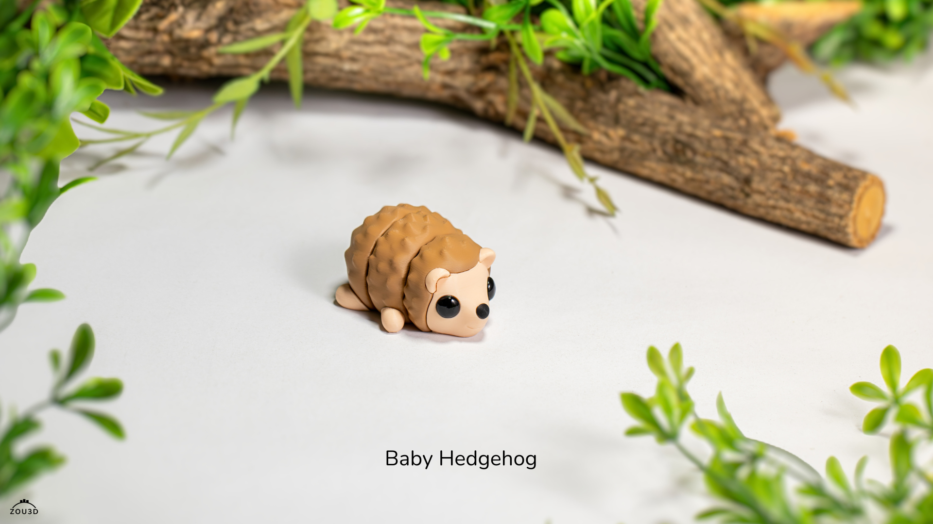 Articulated toy hedgehog on a light surface with greenery