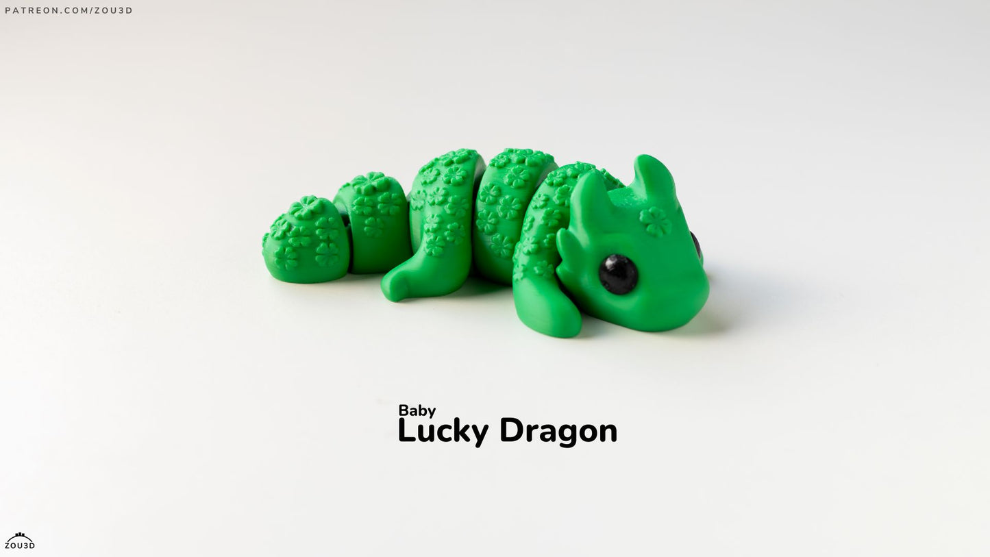 Green dragon toy with 'Baby Lucky Dragon' text on a white background
