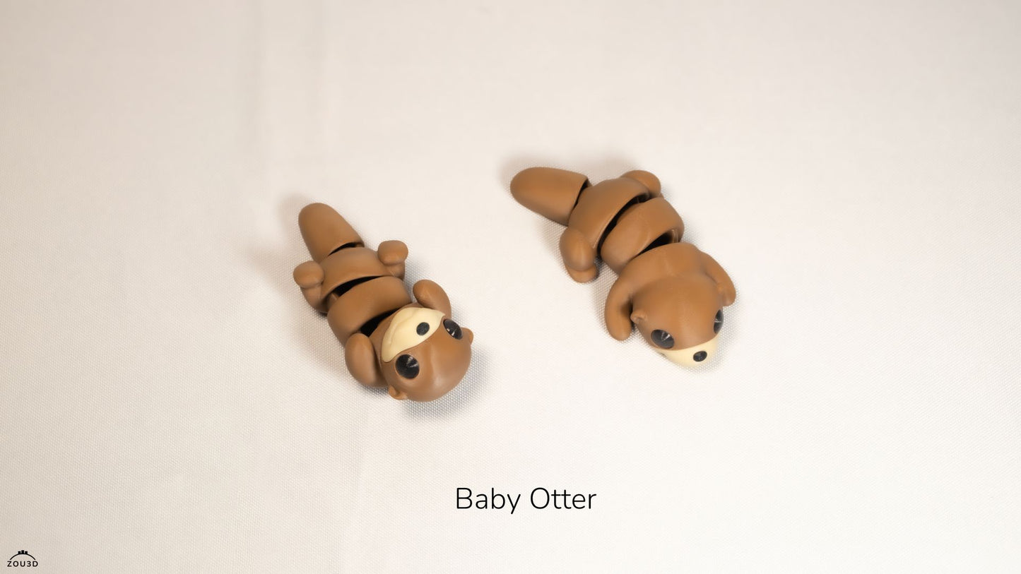 Two clay models of baby otters on a beige background with 'Baby Otter' text.