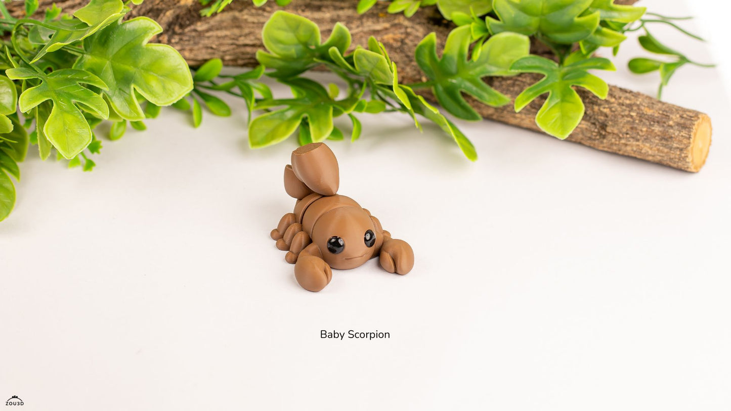 Small brown scorpion figurine on a white surface with green leaves in the background