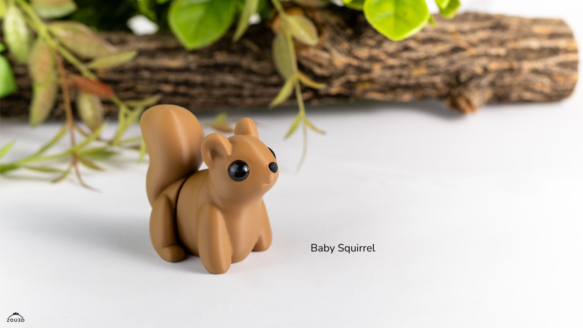 Small brown squirrel figurine on a white surface with greenery in the background
