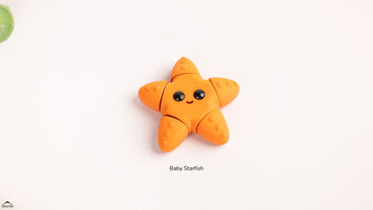 Orange baby starfish toy on a white background