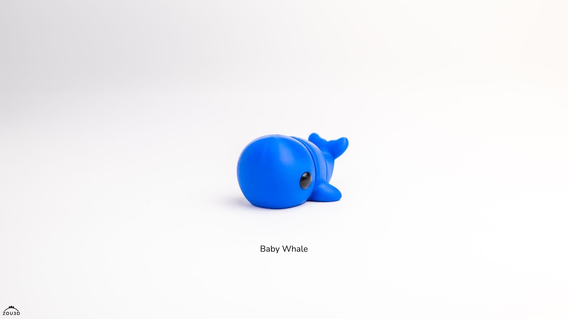 Blue toy whale on a white background with 'Baby Whale' text.