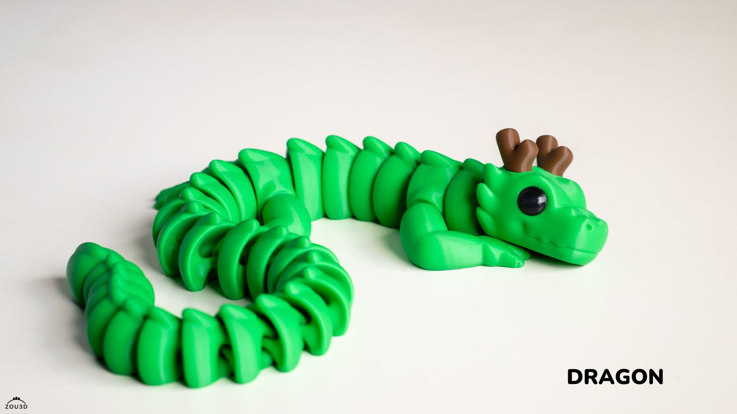 Green dragon toy on a white background