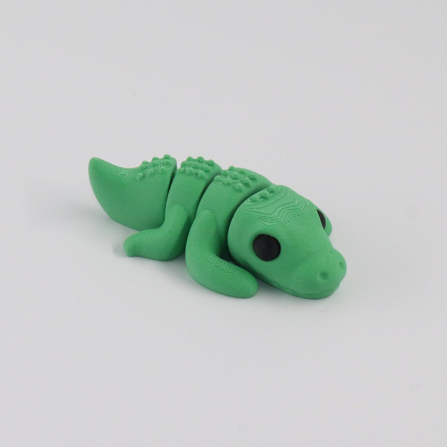 Green crocodile on a white background