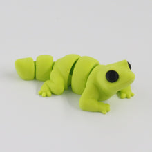 Green lizard toy on a white background