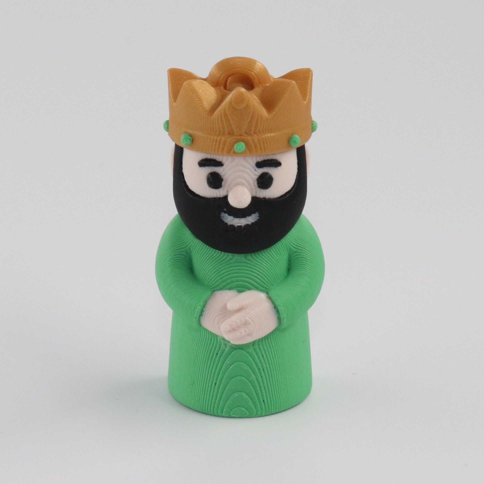 Green figure with a gold crown on a white background