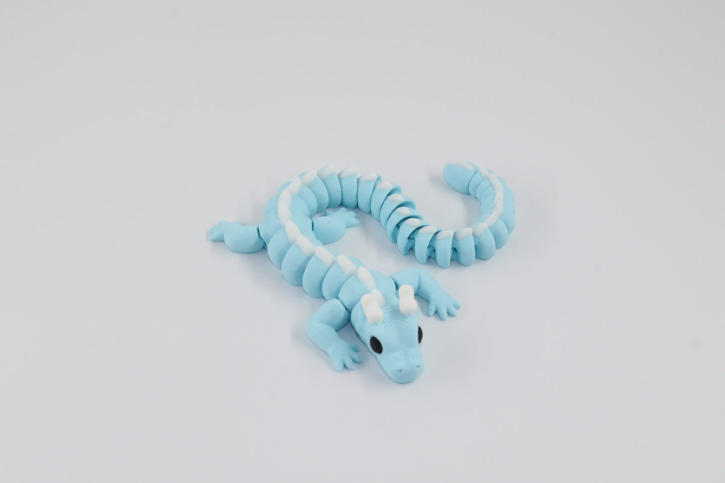 Long Blue Dragon with white spikes and horns