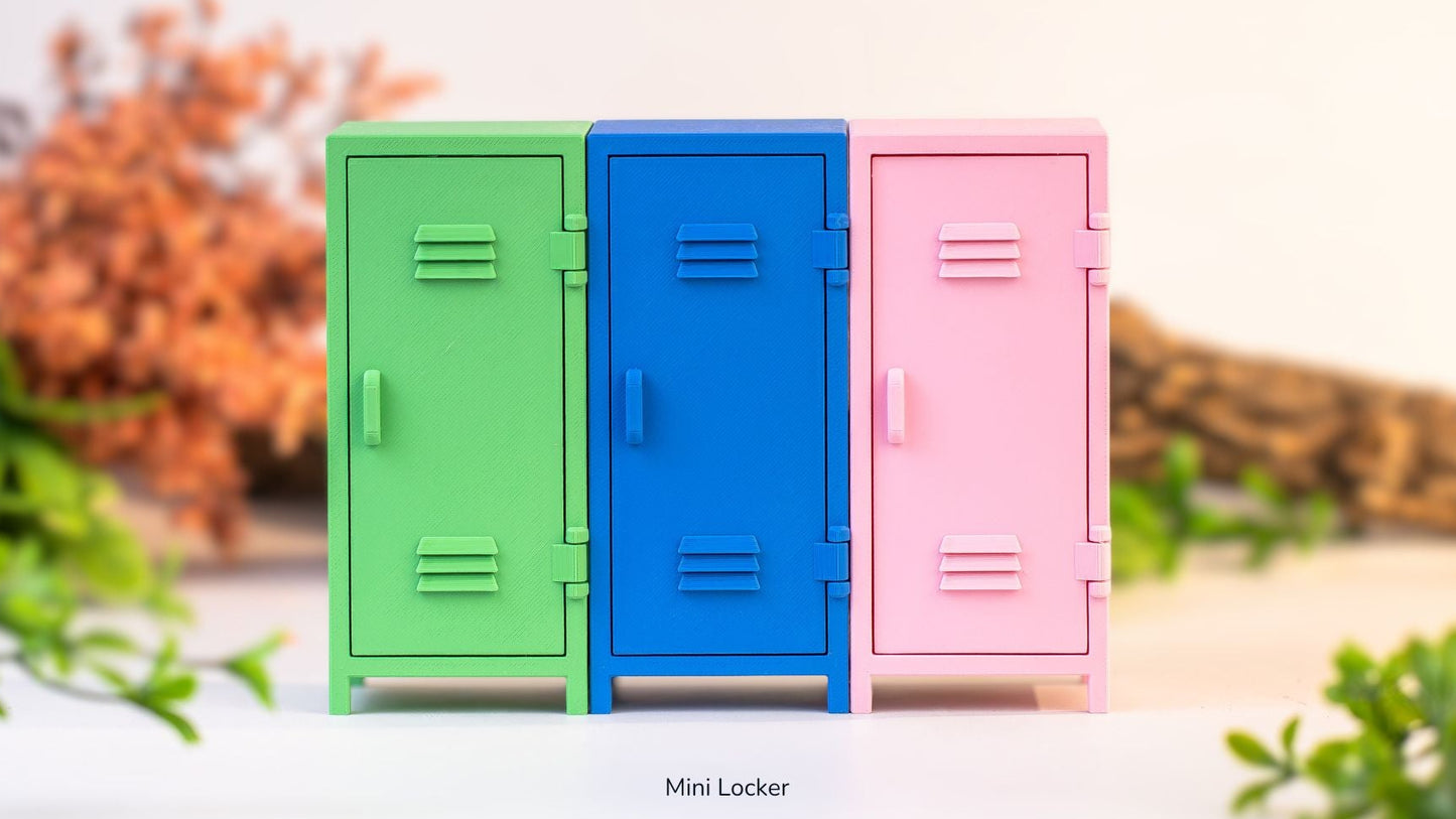 Three colorful mini lockers (green, blue, pink) on a white surface with a blurred natural background.
