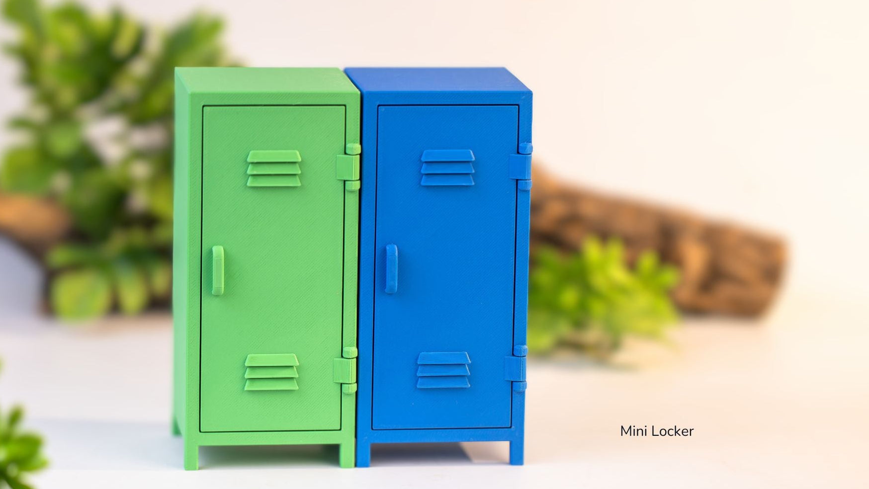 Two mini lockers, one green and one blue, on a light background with plants.