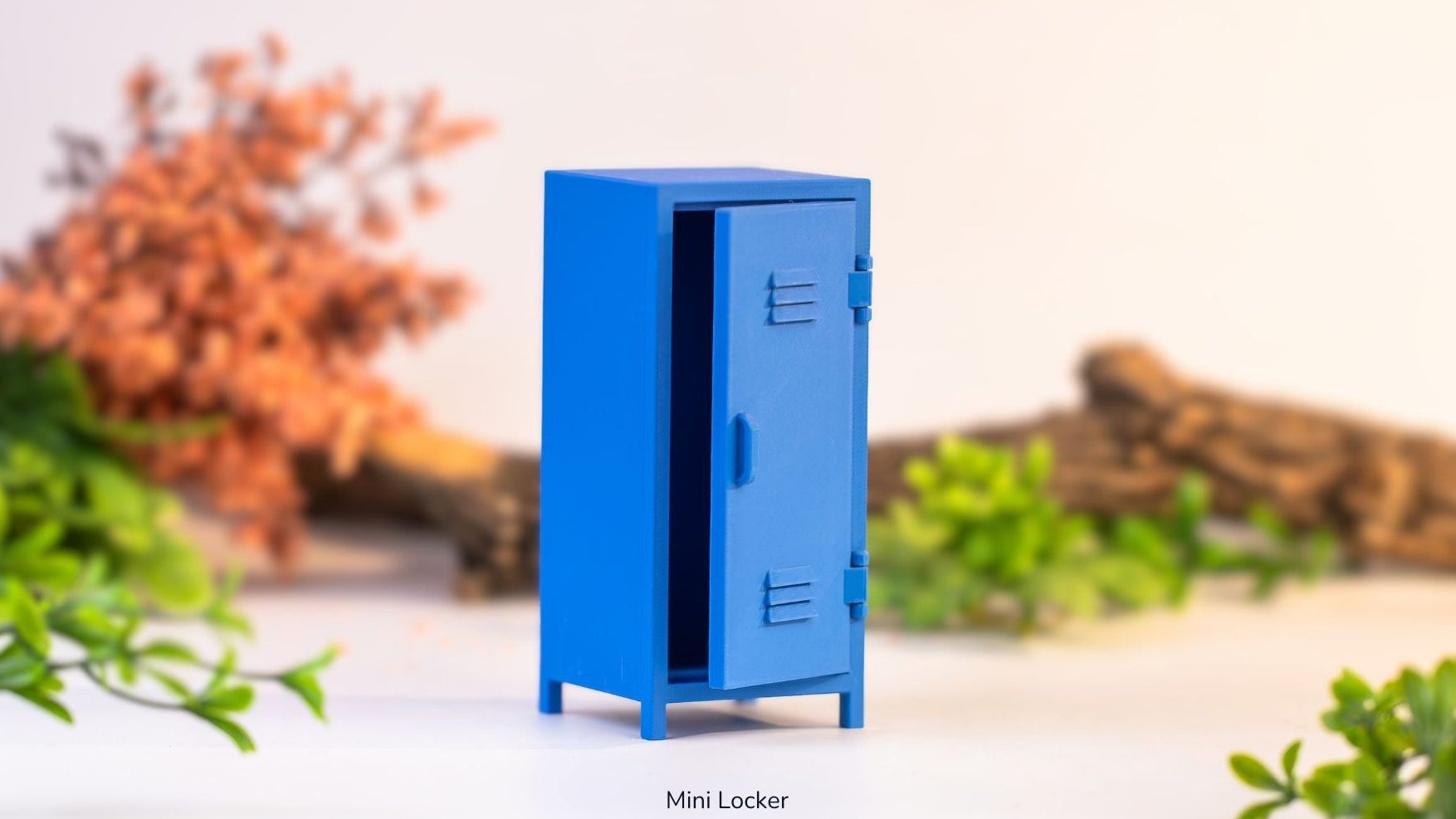 Blue mini locker on a white surface with blurred natural background