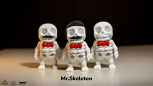 Three skeleton figures with red bow ties labeled 'Mr. Skeleton' on a dark background.