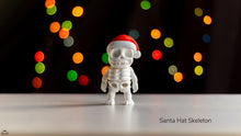 White skeleton figurine wearing a Santa hat with colorful lights in the background