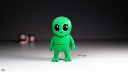Green alien figurine with a dark background