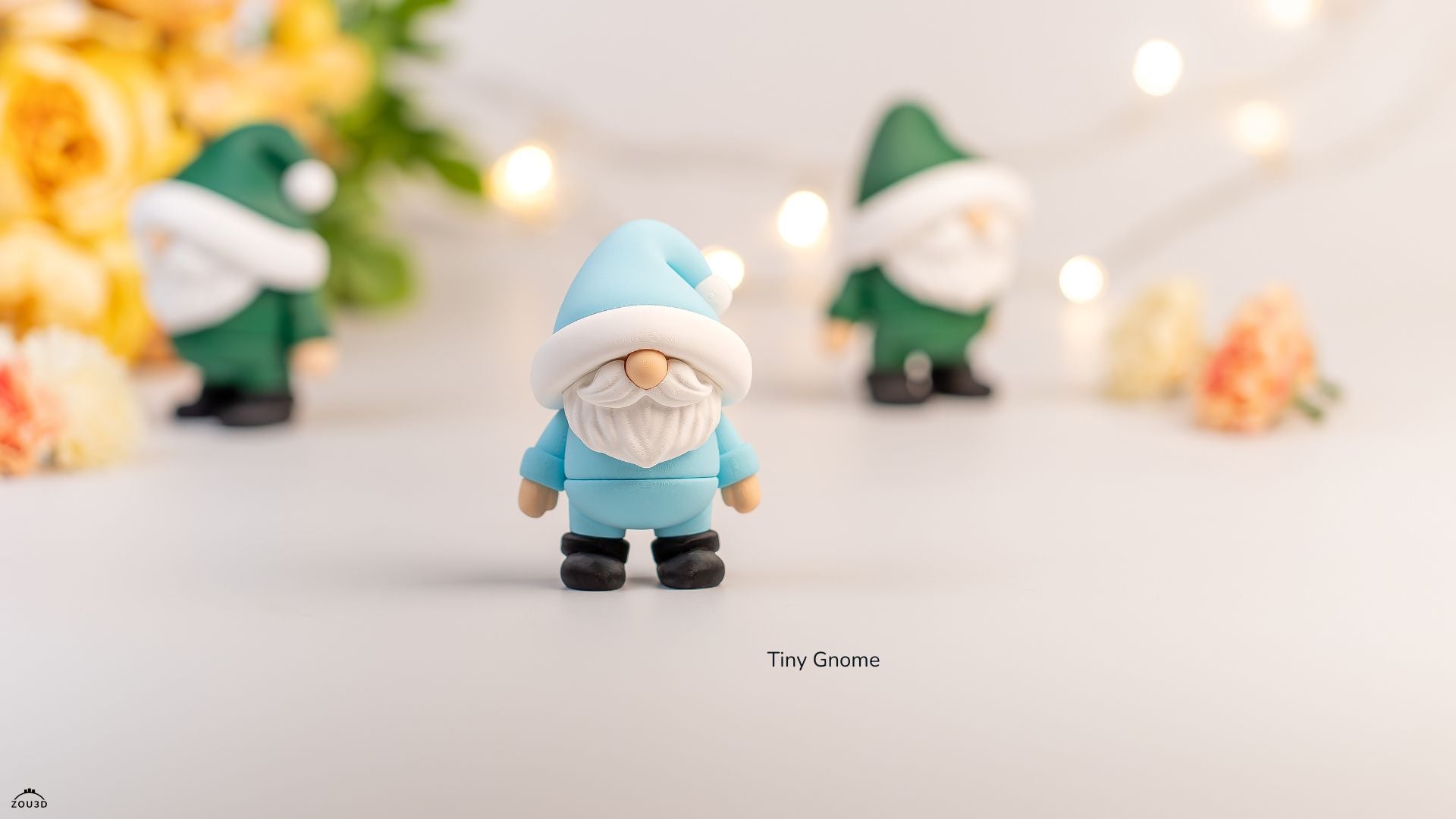 Small gnome figurine with a blue hat and outfit on a light background with blurred decorative elements.