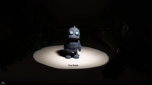 Small robot toy on a dark background with 'Tiny Robot' text