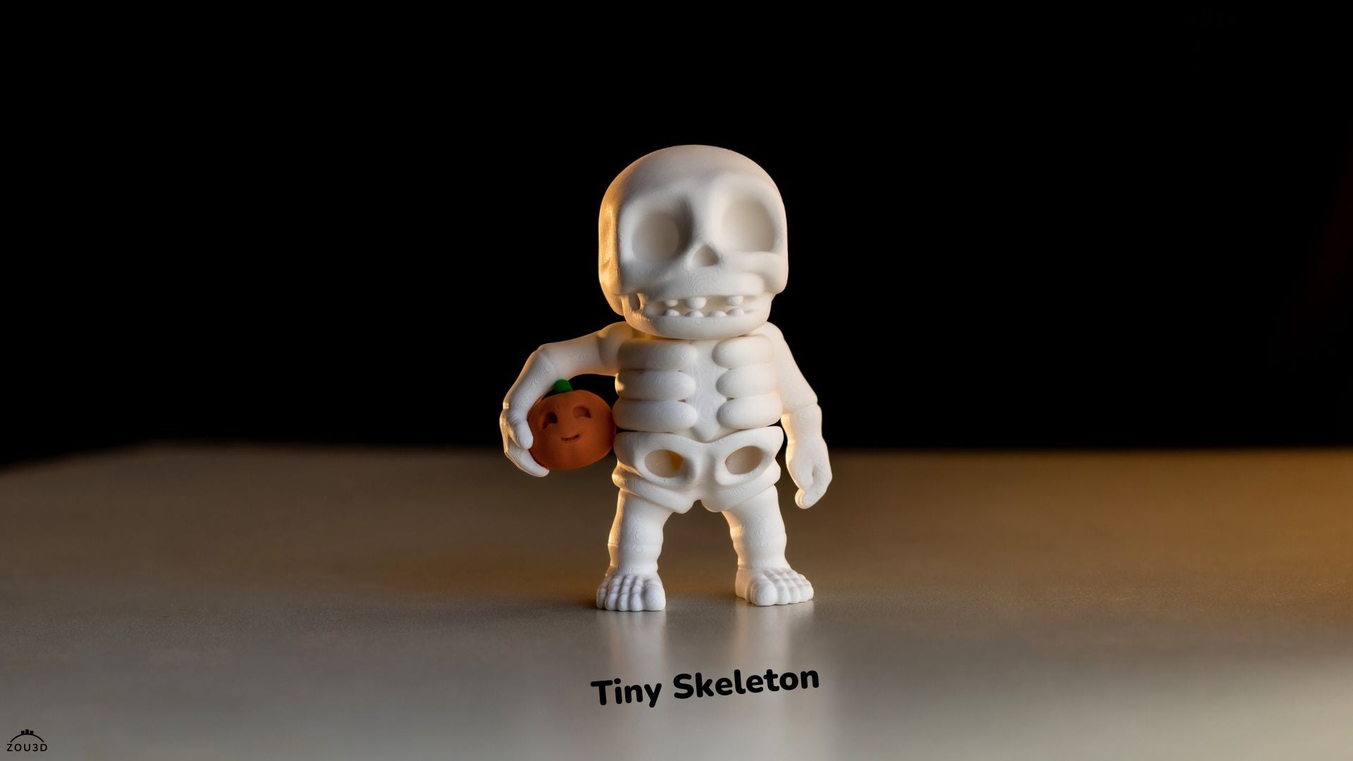 White skeleton figurine with a smaller figure inside on a dark background