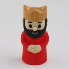 Small figurine of a bearded king wearing a red robe and gold crown on a white background