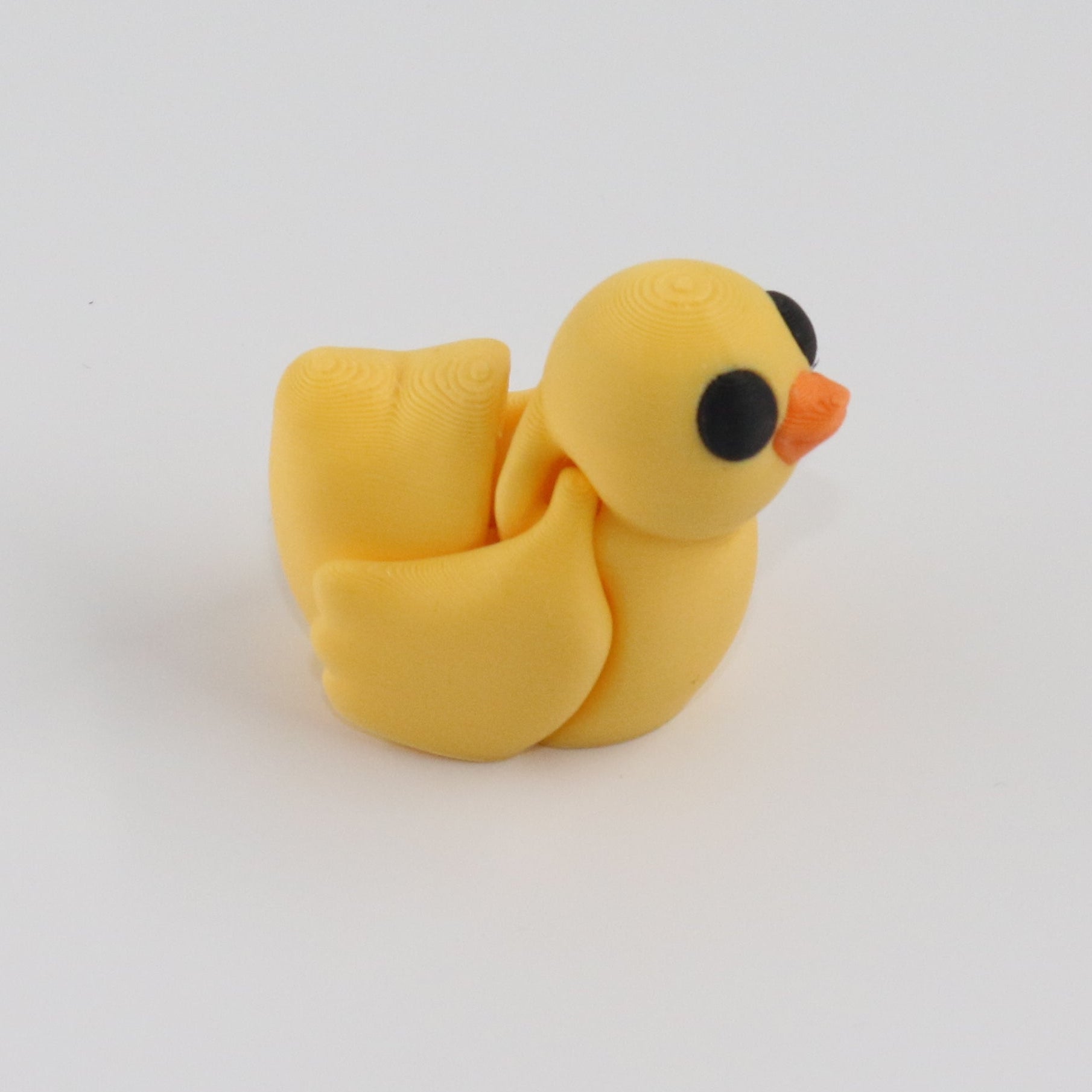 Articulated Yellow Duck on a white background