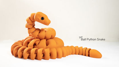 Orange ball python snake toy on a white background